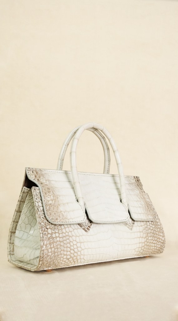 Adriana Lungo handbag crafted from rare Himalayan crocodile leather with natural white and grey gradient tones