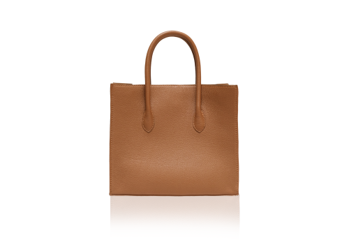 A minimal and structured KYRA Roomy Tote Bag in warm Caramel calf leather, showcasing its clean-lined leather handbag design.