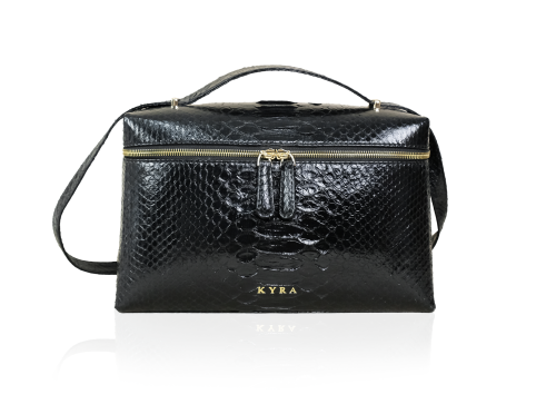 The KYRA Picco Medium vanity black box bag in timeless genuine python leather, showcasing its structured design and double gold zippers.