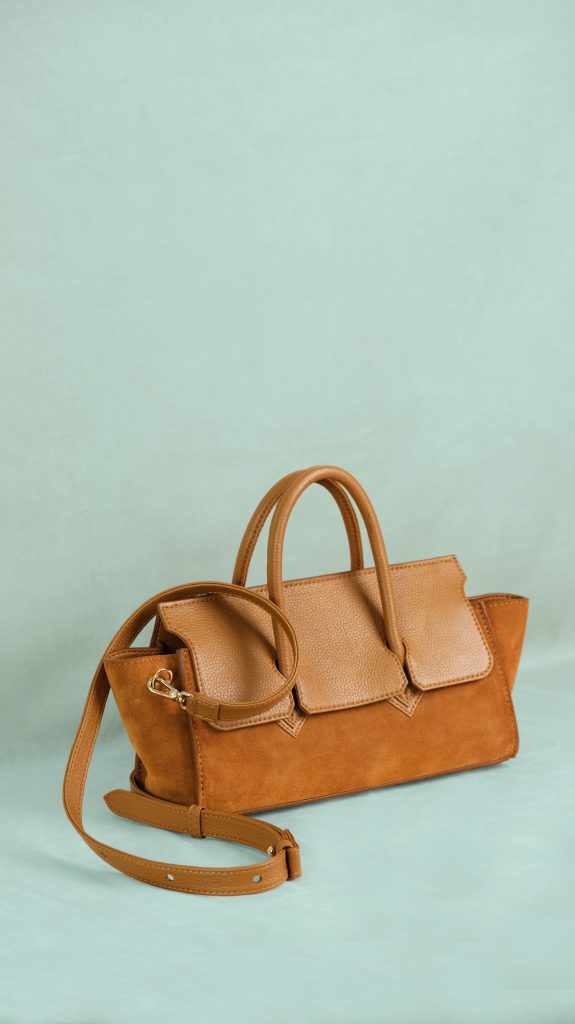 KYRA Adriana Lungo Regal Suede leather handbag featuring a modern reimagination of the classic Adriana with a structured top handle for Eid 2026.