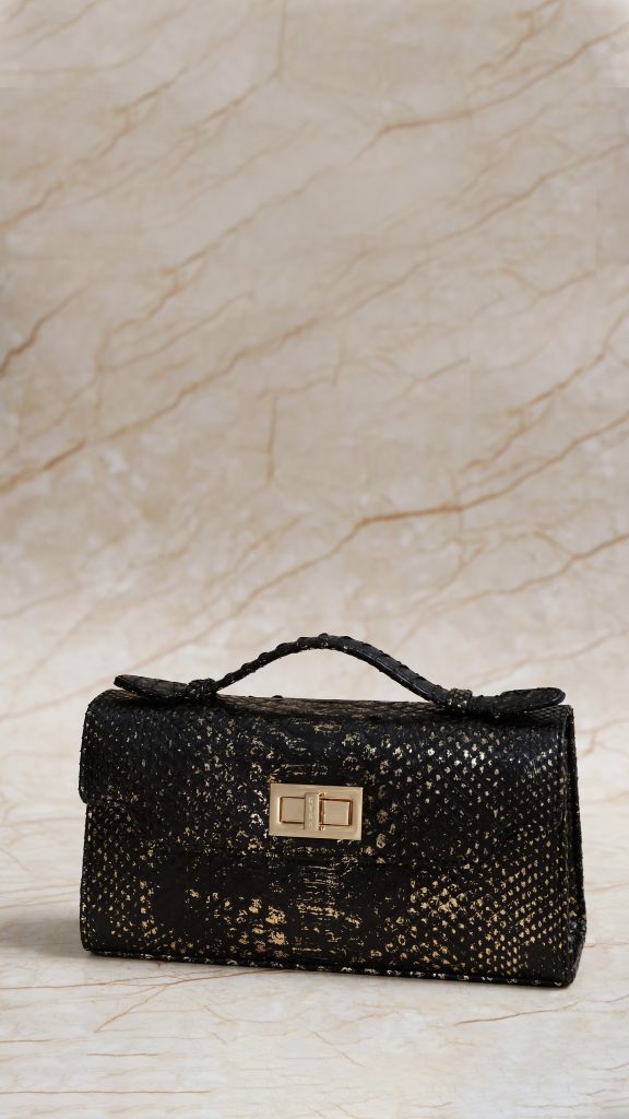 KYRA Luna 25 structured black python leather handbag, 3-in-1 luxury bag (top-handle, clutch, shoulder bag), gold signature hardware for Eid 2026.