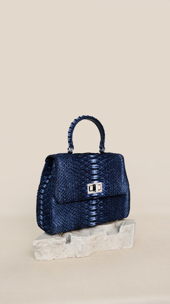 KYRA Lauren mini handbag in Blue Washed python leather, cute structured design with signature gold lock and strong top handle for Eid 2026.