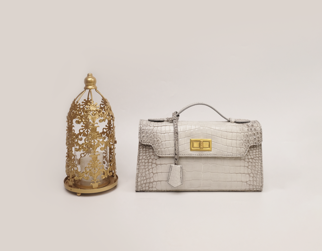 KYRA Luna 29 genuine crocodile leather handbag featuring a signature lock and contrast stitching for a refined quiet luxury look.