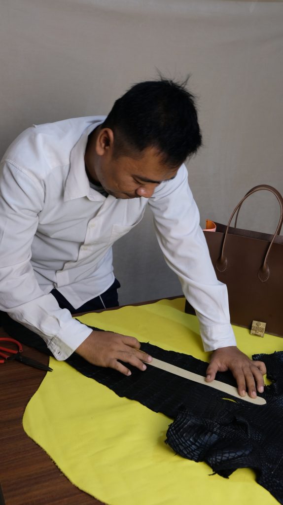 Pak Dadang, Senior craftman in Cardina, KYRA's manufacture. His specialization is in crocodile and ostrich leather bag