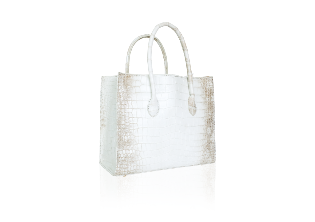 A luxury KYRA Roomy shoulder bag featuring an exquisite Himalayan crocodile-embossed leather gradient from white to brown with dual top handles on a neutral background.